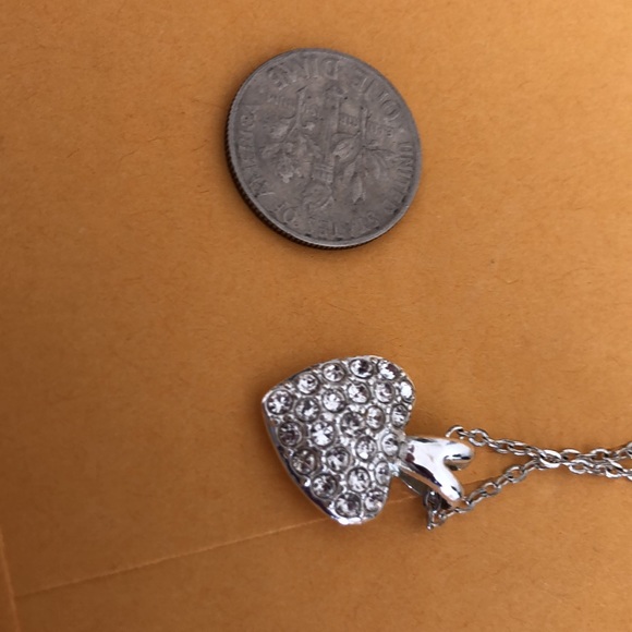 Heart bling dime size w/solid back with slight rub marks on back. Silver color. - Picture 2 of 15
